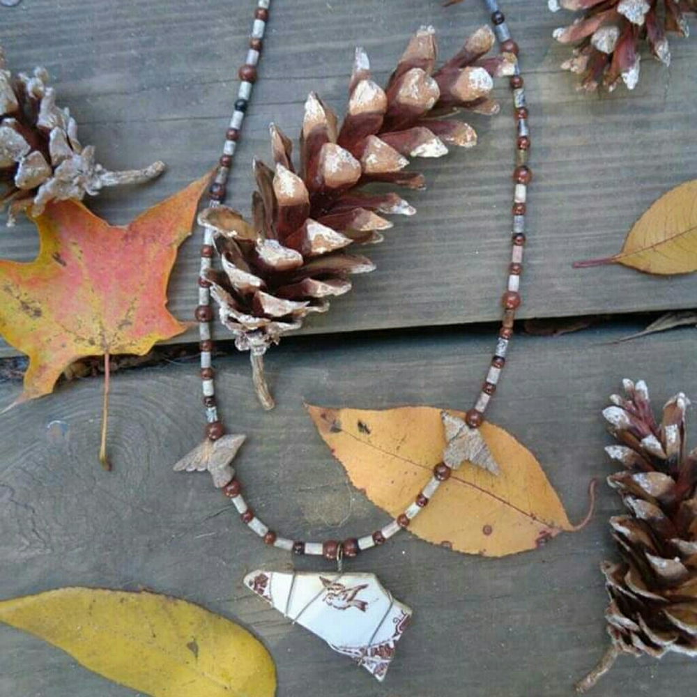 Brown bird necklace